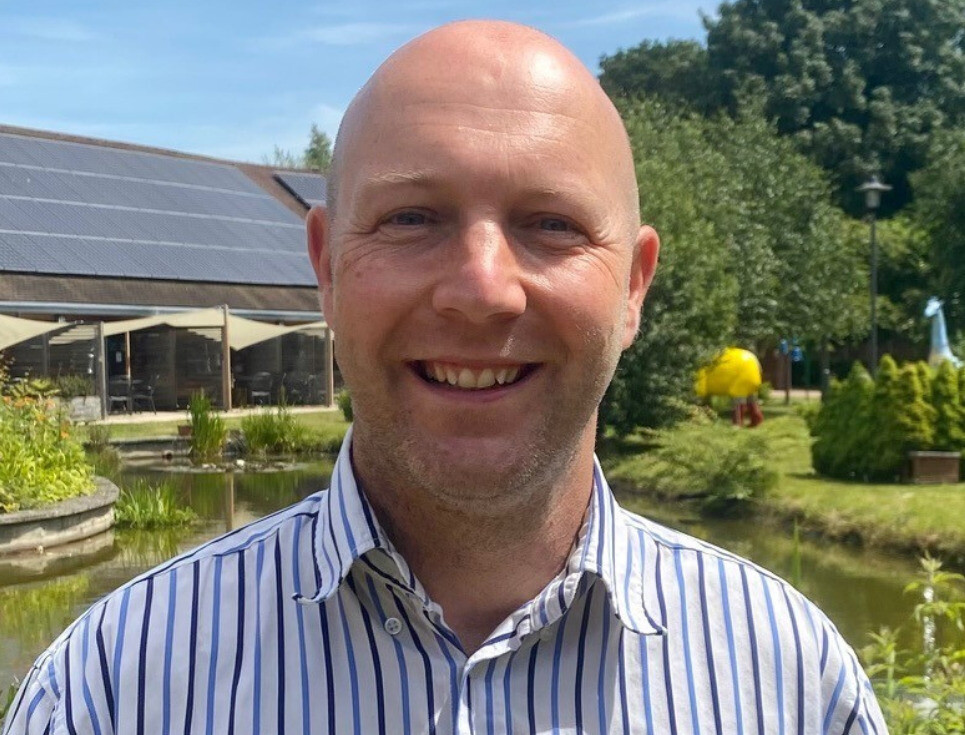 Matt Jackson in the hospice gardens on a sunny day.